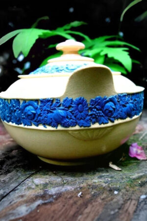 Wedgwood early 19th century caneware sugar box with blue fruits and flowers relief decorations