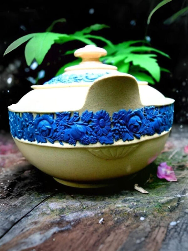 Wedgwood early 19th century caneware sugar box with blue fruits and flowers relief decorations